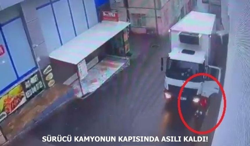 Sürücü kamyonun kapısında asılı kaldı!