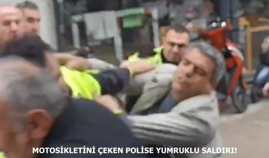 Motosikletini çeken polislere yumruk attı!